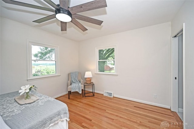 6383 Todhunter Rd, Middletown, OH 45044 - living area with light wood-style flooring and a ceiling fan