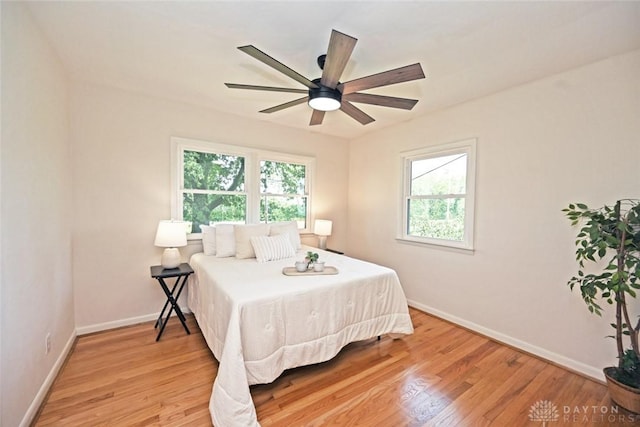6383 Todhunter Rd, Middletown, OH 45044 - bedroom with multiple windows, light wood-style floors, and ceiling fan