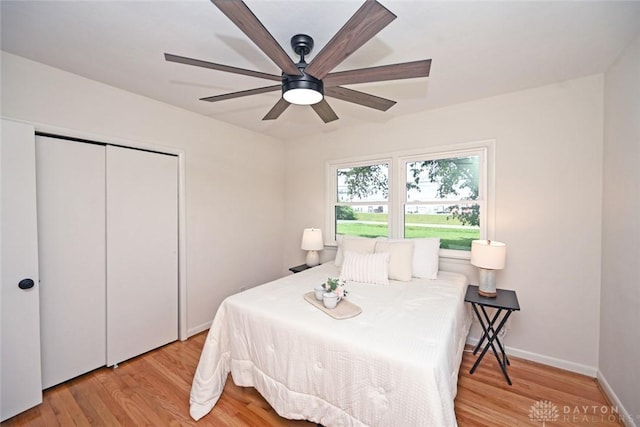 6383 Todhunter Rd, Middletown, OH 45044 - bedroom with light wood-style floors, a closet, and a ceiling fan