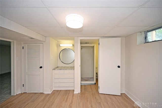 6383 Todhunter Rd, Middletown, OH 45044 - basement with light wood-style flooring and a paneled ceiling