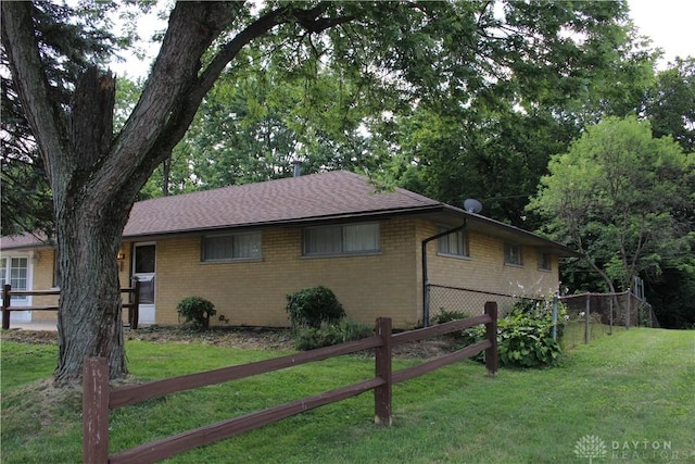 4912 Powell Rd, Huber Heights, OH 45424 - view of front of house with brick siding and roof with shingles