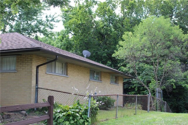 4912 Powell Rd, Huber Heights, OH 45424 - view of property exterior featuring brick siding and a shingled roof