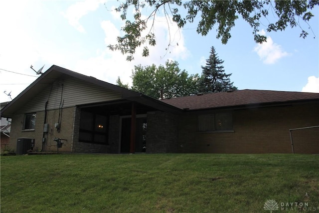 4912 Powell Rd, Huber Heights, OH 45424 - back of property featuring brick siding and a lawn