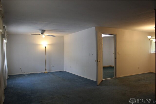 4912 Powell Rd, Huber Heights, OH 45424 - empty room with dark carpet and a ceiling fan
