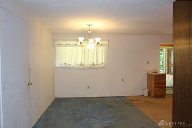 4912 Powell Rd, Huber Heights, OH 45424 - carpeted empty room featuring a chandelier and baseboards