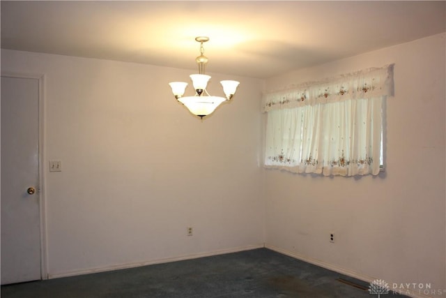 4912 Powell Rd, Huber Heights, OH 45424 - empty room featuring dark colored carpet and baseboards