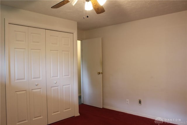 4912 Powell Rd, Huber Heights, OH 45424 - unfurnished bedroom featuring a closet, dark colored carpet, and ceiling fan
