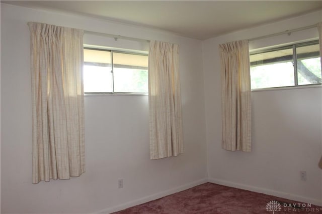 4912 Powell Rd, Huber Heights, OH 45424 - unfurnished room featuring plenty of natural light and carpet flooring