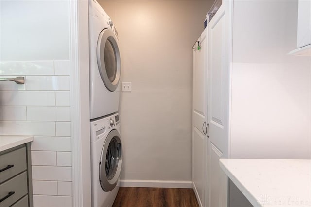 1097 Trudy Ct, Clearcreek Twp, OH 45036 - washroom with stacked washer and clothes dryer and dark wood-type flooring