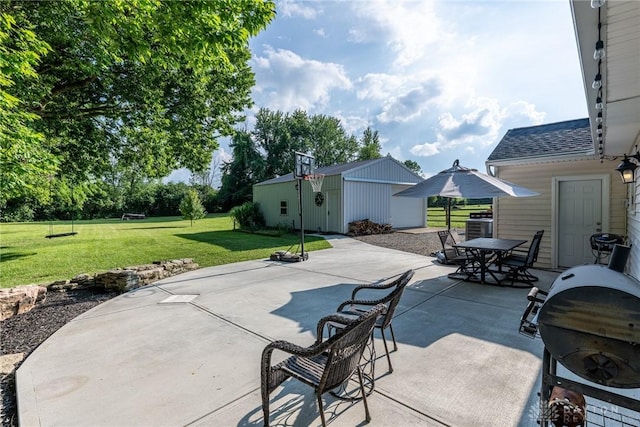 1097 Trudy Ct, Clearcreek Twp, OH 45036 - view of patio / terrace with outdoor dining area, an outbuilding, and grilling area