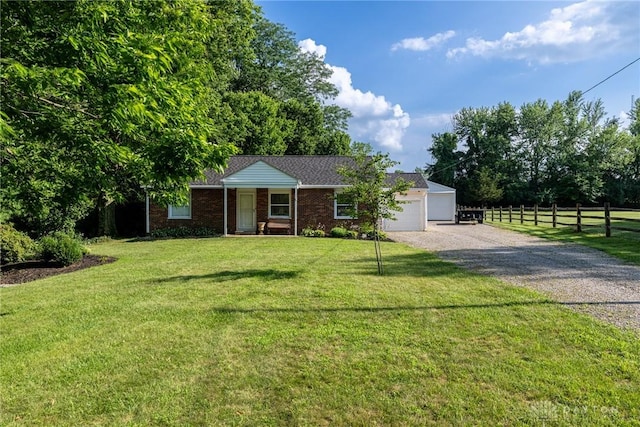 1097 Trudy Ct, Clearcreek Twp, OH 45036 - ranch-style home with gravel driveway, an attached garage, and brick siding
