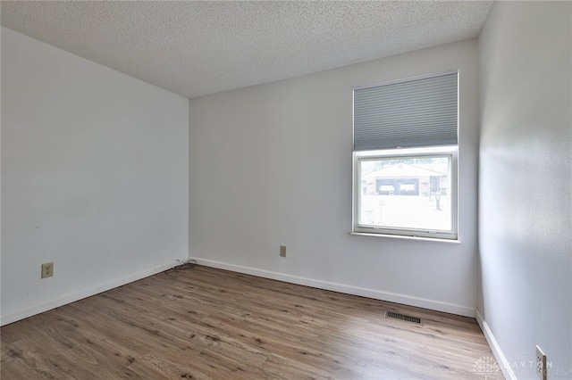 5979 Timbergate Trl, Dayton, OH 45424 - unfurnished room featuring wood finished floors and a textured ceiling