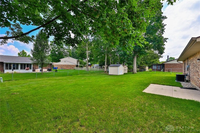 5979 Timbergate Trl, Dayton, OH 45424 - fenced backyard featuring a storage unit
