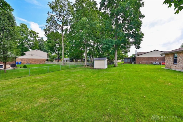 5979 Timbergate Trl, Dayton, OH 45424 - fenced backyard with a storage unit