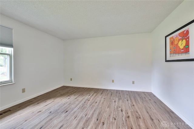 5979 Timbergate Trl, Dayton, OH 45424 - empty room with wood finished floors and a textured ceiling