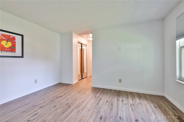 5979 Timbergate Trl, Dayton, OH 45424 - unfurnished room with wood finished floors and a textured ceiling