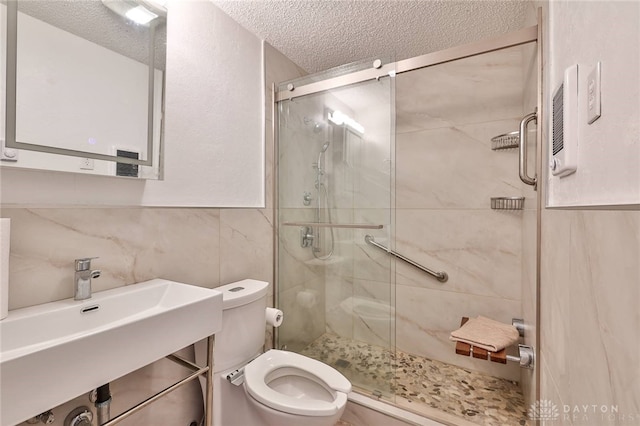 5979 Timbergate Trl, Dayton, OH 45424 - full bath featuring a textured ceiling, a shower stall, and tile walls