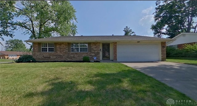 5970 Clearlake Dr, Dayton, OH 45424 - ranch-style house with brick siding, a garage, driveway, and a front yard