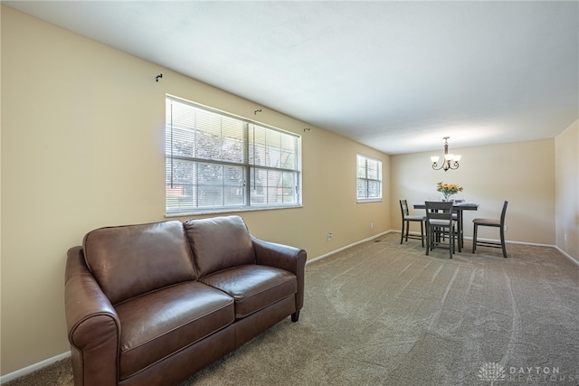 5970 Clearlake Dr, Dayton, OH 45424 - living area featuring a chandelier and light colored carpet