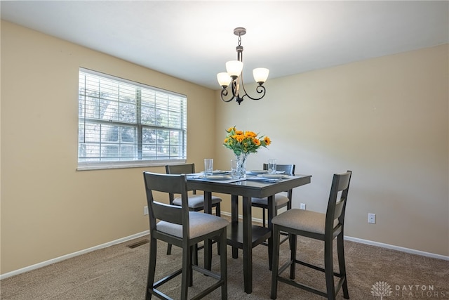 5970 Clearlake Dr, Dayton, OH 45424 - dining area featuring a chandelier and carpet