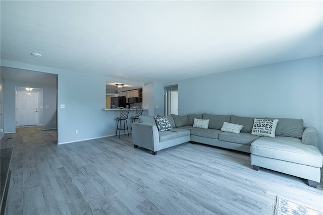 5970 Clearlake Dr, Dayton, OH 45424 - living room featuring light wood-style floors and baseboards