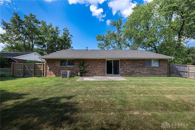 5970 Clearlake Dr, Dayton, OH 45424 - rear view of property with a patio area, brick siding, a fenced backyard, and a shingled roof