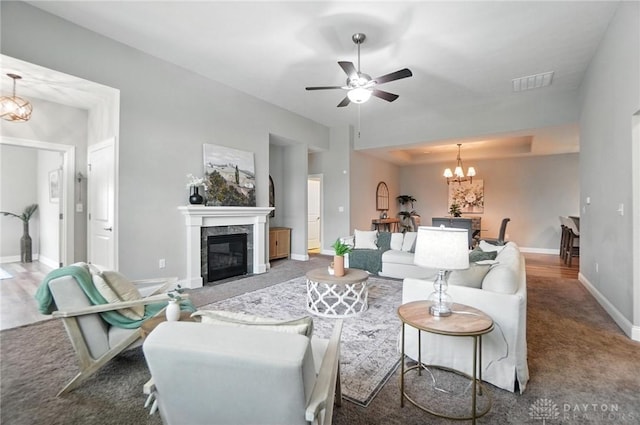 1310 Bourdeaux Way, Clearcreek Twp, OH 45458 - living room with a ceiling fan, a high end fireplace, a chandelier, and carpet floors