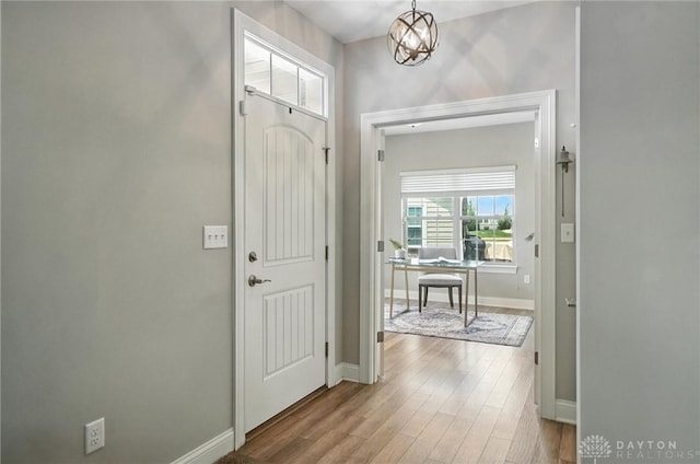 1310 Bourdeaux Way, Clearcreek Twp, OH 45458 - foyer featuring wood finished floors and a chandelier