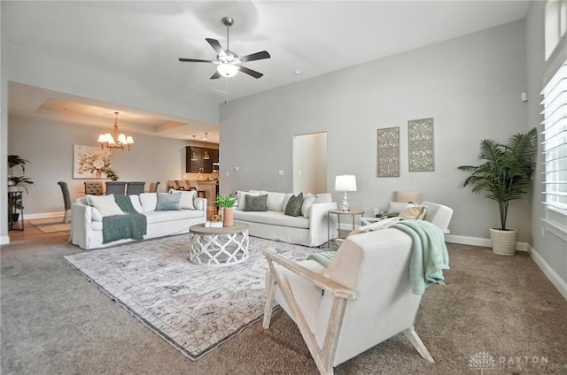 1310 Bourdeaux Way, Clearcreek Twp, OH 45458 - carpeted living room with a chandelier and ceiling fan