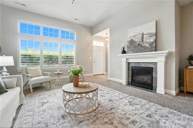 1310 Bourdeaux Way, Clearcreek Twp, OH 45458 - carpeted living room with a tile fireplace and baseboards