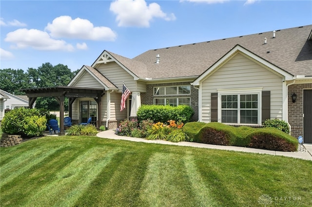 1310 Bourdeaux Way, Clearcreek Twp, OH 45458 - single story home with brick siding, a front yard, a shingled roof, and a pergola