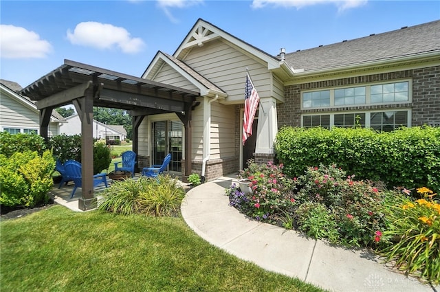 1310 Bourdeaux Way, Clearcreek Twp, OH 45458 - entrance to property featuring brick siding, a lawn, and a patio area