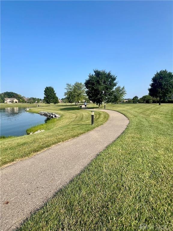 1310 Bourdeaux Way, Clearcreek Twp, OH 45458 - view of home's community with a water view and a lawn