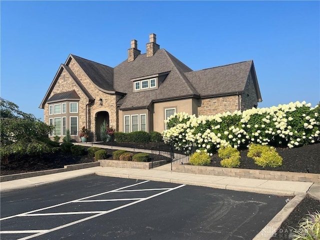 1310 Bourdeaux Way, Clearcreek Twp, OH 45458 - view of building exterior featuring uncovered parking
