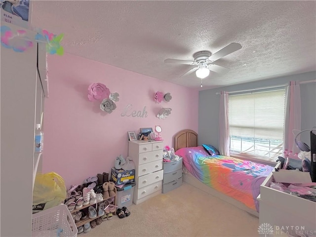 11629 Pippin Rd, Colerain Twp, OH 45231 - carpeted bedroom with a textured ceiling and a ceiling fan