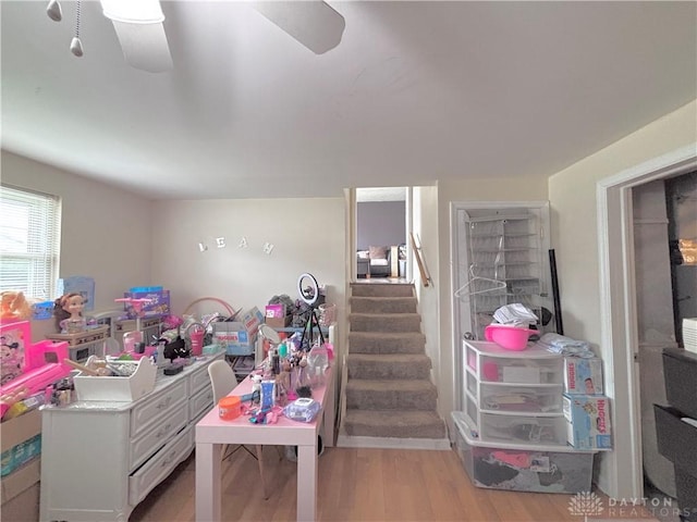 11629 Pippin Rd, Colerain Twp, OH 45231 - basement with light wood finished floors, stairs, and a ceiling fan