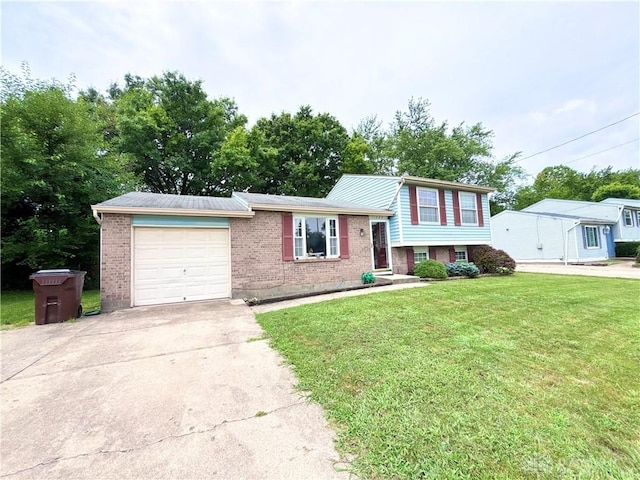 11629 Pippin Rd, Colerain Twp, OH 45231 - tri-level home featuring an attached garage, driveway, brick siding, and a front lawn