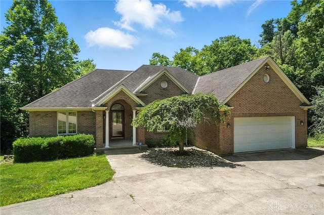 5567 Day Rd, Colerain Twp, OH 45252 - ranch-style house with driveway, brick siding, a garage, roof with shingles, and a front lawn