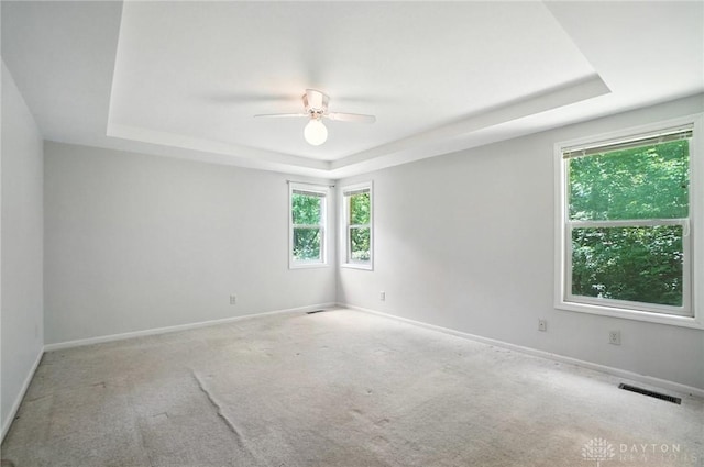 5567 Day Rd, Colerain Twp, OH 45252 - empty room featuring a raised ceiling, ceiling fan, and carpet floors