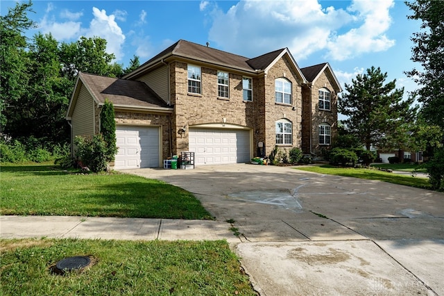 213 Bentridge Dr, Clearcreek Twp, OH 45458 - traditional home featuring concrete driveway, a front yard, brick siding, an attached garage, and roof with shingles