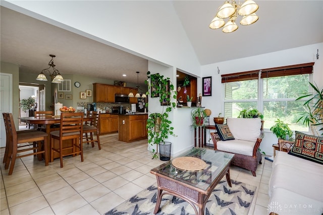 213 Bentridge Dr, Clearcreek Twp, OH 45458 - living room featuring a chandelier, lofted ceiling, and light tile patterned floors