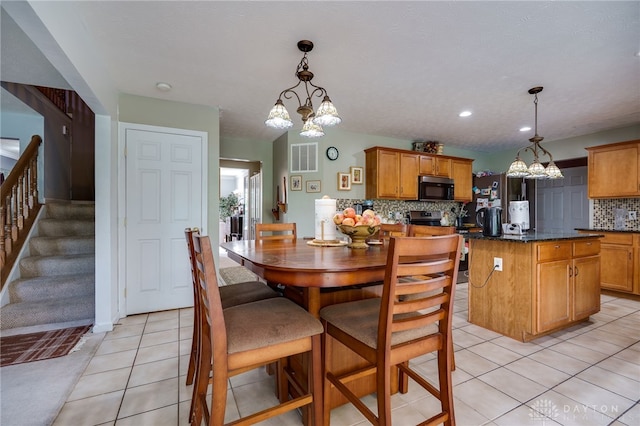 213 Bentridge Dr, Clearcreek Twp, OH 45458 - dining room featuring a chandelier, light tile patterned floors, stairway, and recessed lighting