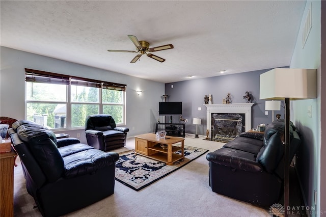 213 Bentridge Dr, Clearcreek Twp, OH 45458 - living room featuring carpet, ceiling fan, a premium fireplace, and a textured ceiling
