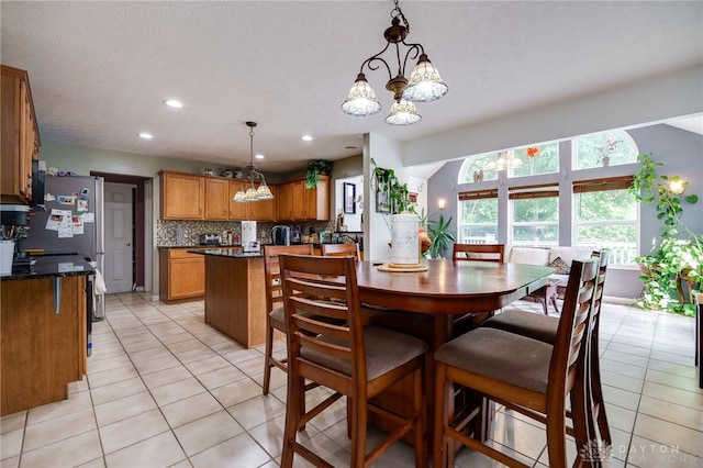 213 Bentridge Dr, Clearcreek Twp, OH 45458 - dining room with a chandelier, light tile patterned floors, and recessed lighting