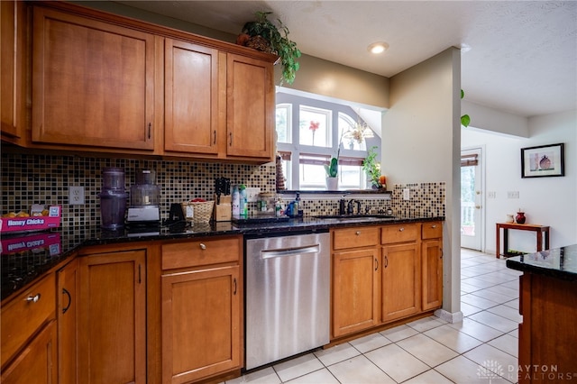 213 Bentridge Dr, Clearcreek Twp, OH 45458 - kitchen with brown cabinets, dishwasher, decorative backsplash, and light tile patterned floors