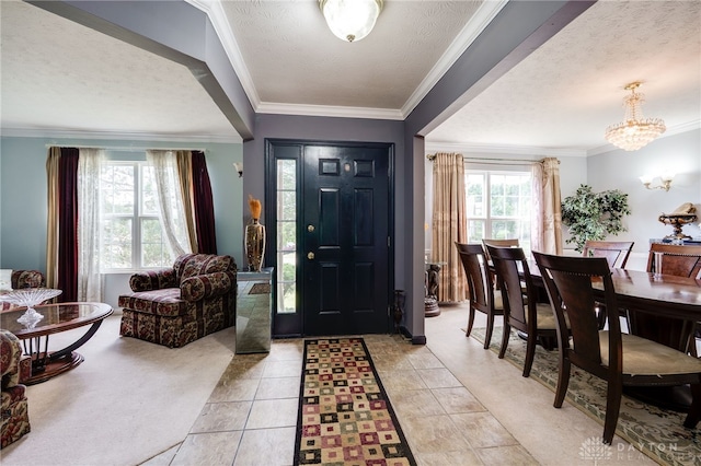 213 Bentridge Dr, Clearcreek Twp, OH 45458 - entryway featuring a textured ceiling, a chandelier, and crown molding