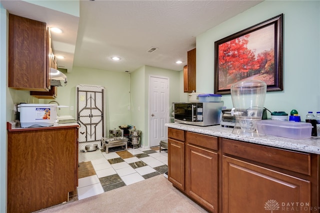 213 Bentridge Dr, Clearcreek Twp, OH 45458 - kitchen featuring stainless steel microwave, recessed lighting, brown cabinetry, and range hood