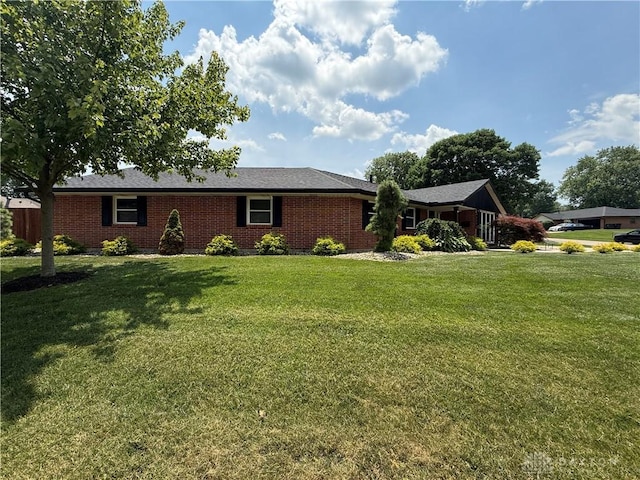 4220 Sillman Pl, Kettering, OH 45440 - ranch-style home featuring a front lawn and brick siding