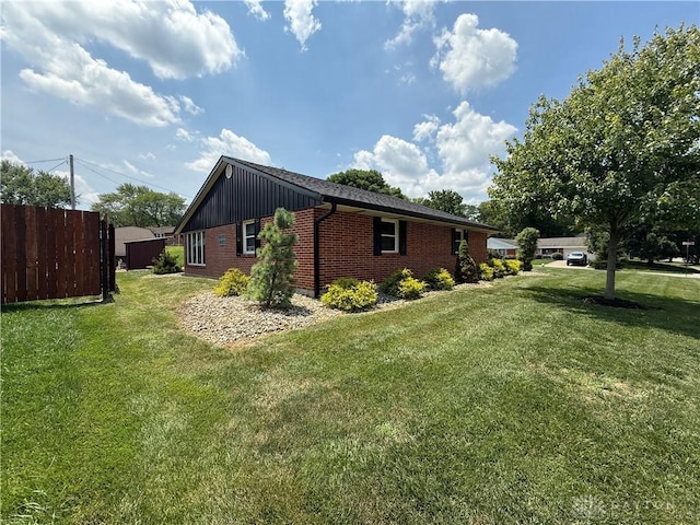 4220 Sillman Pl, Kettering, OH 45440 - view of side of property with board and batten siding and brick siding