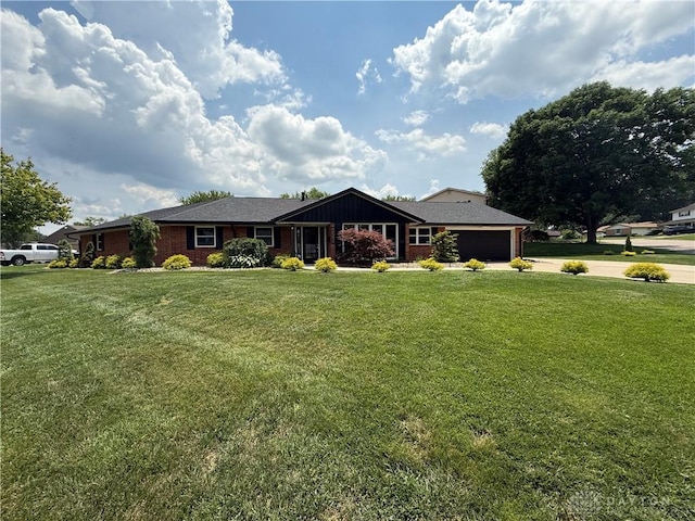 4220 Sillman Pl, Kettering, OH 45440 - single story home with driveway, a garage, a front lawn, and brick siding